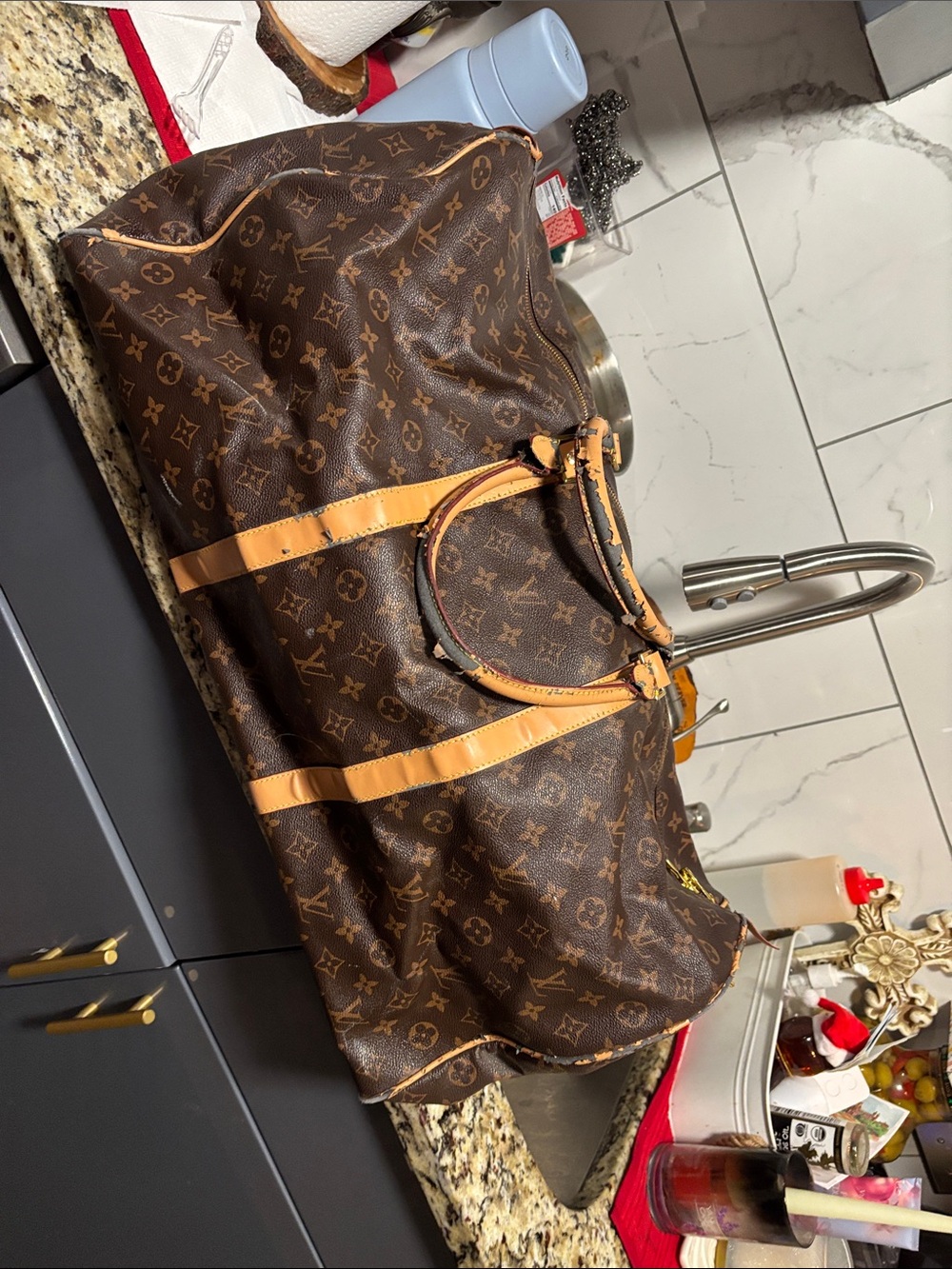 Louis Vuitton Brown Monogram Duffel with Tan Trim w / peelings from LT storage.